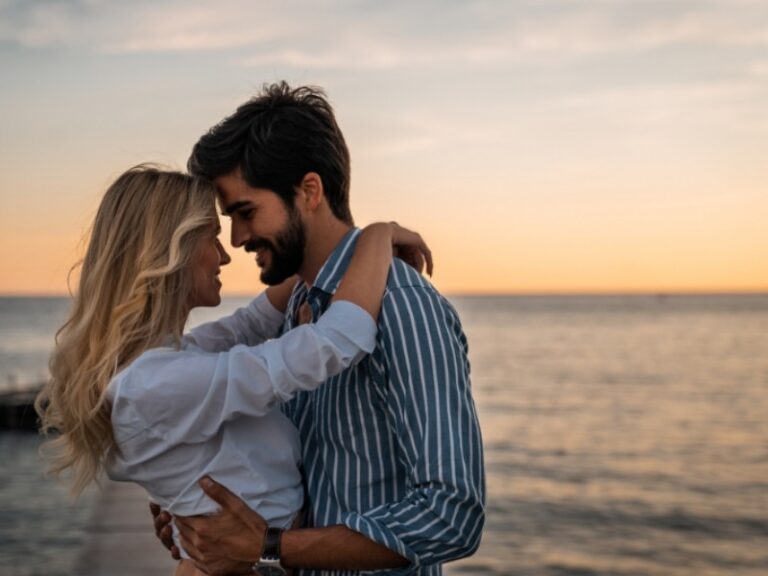 Sullivan's Island: A romantic couple embrace at the beach near their vacation rental on Sullivan's Island, SC.